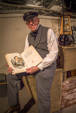 Stephen Foster holding a book